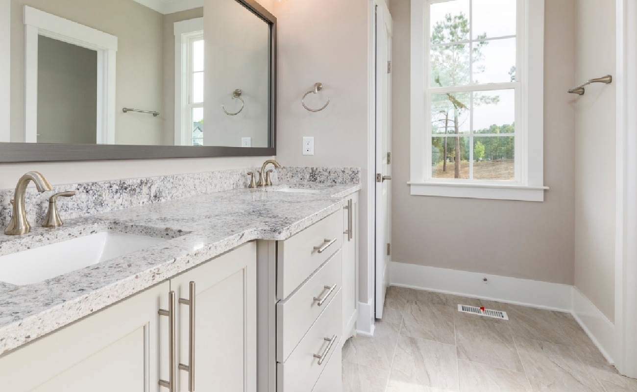 BG-3 A modern kitchen showcasing perfect pairings of kitchen counters and backsplash.