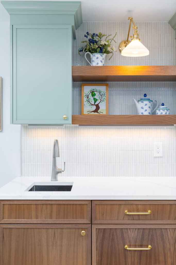 A coordinated kitchen design showcasing cabinets, countertops, and backsplashes.